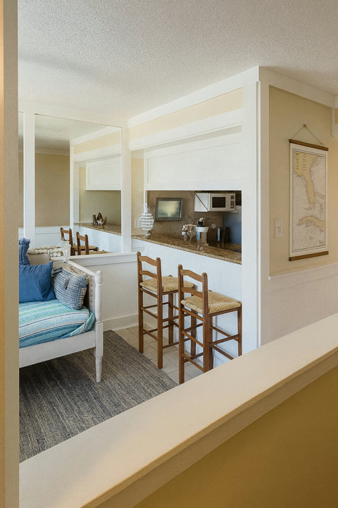 Cozy daybed nook beside breakfast bar seating