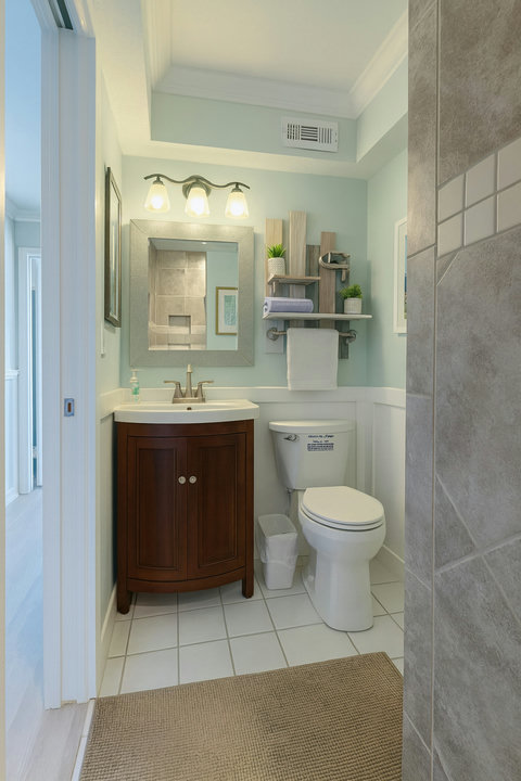Seafoam bath with wood vanity and stone shower