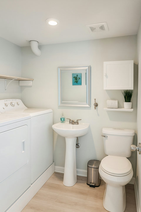 Laundry and powder room with washer and dryer