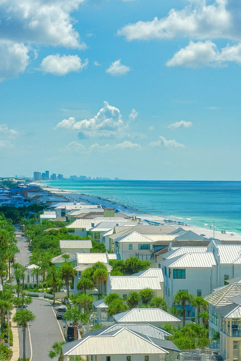 Aerial coastline of white sand and emerald waters