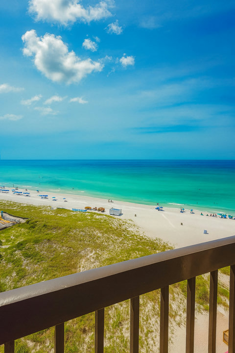 Balcony view over dunes to turquoise Gulf beach