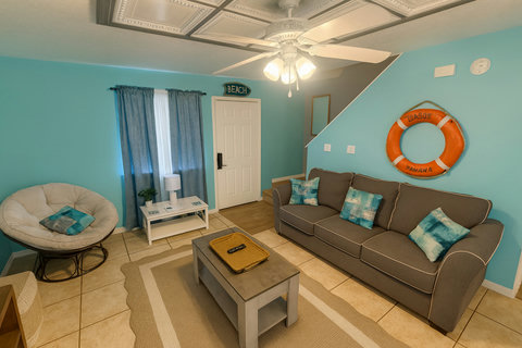 Gray sofa lounge with lifebuoy and papasan chair