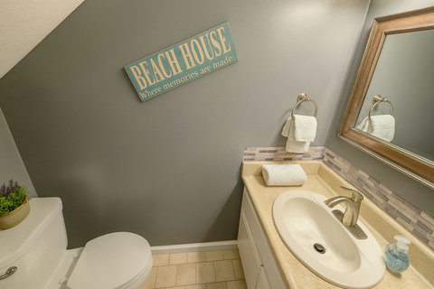 Beach House vanity bath with mosaic tile backsplash