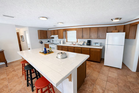 Spacious kitchen island with bar seating for three