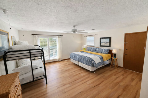 King bedroom with twin bunks for family stays