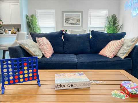 Game-night coffee table with sofa and boat art