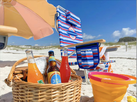 Picnic basket and 30A drinks on white sand
