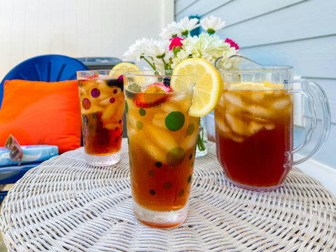 Porch iced tea with flowers and blue patio chair