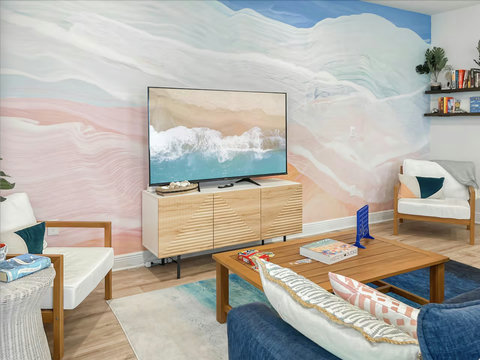 Wave mural TV lounge with armchairs and games