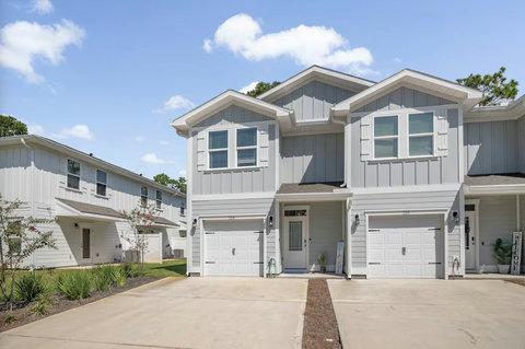 Modern gray townhome with private garage entry