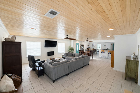 spacious living room with mounted TV