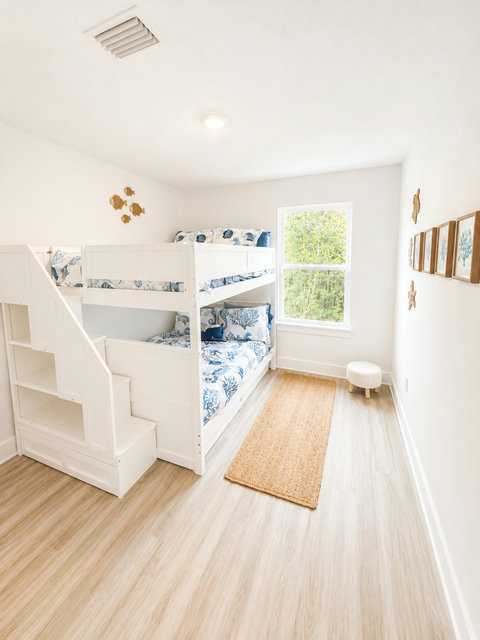 Kids bunk beds with stair storage and coastal bedding