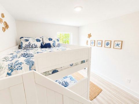 Nautical bunk room with whale pillow and sea turtles