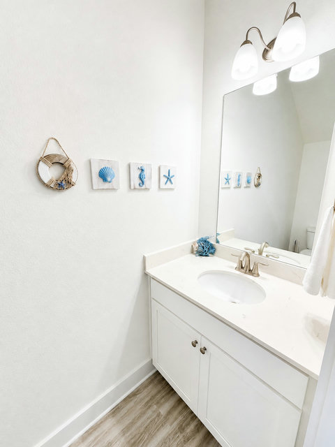 Charming powder room with nautical wall accents