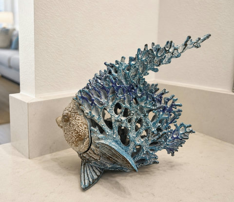 Blue coral fish sculpture accent on countertop