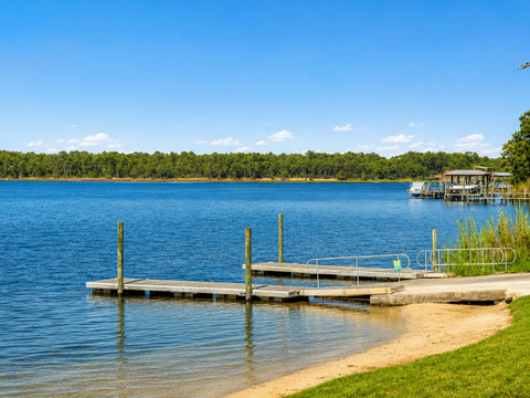 Scenic View – Tranquil waterfront view of the bayou with a private dock and lush shoreline.