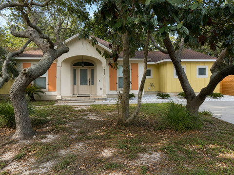 Set on a quiet, tree-lined lot with mature oaks and easy access.