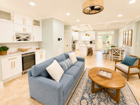 Natural light fills the great room, connecting living, dining, and kitchen for easy togetherness.