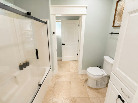 Clean, bright full bath with a tub-and-shower combo — great for families.