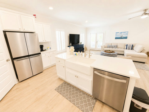 The kitchen island and stainless appliances open right to the living area, so you're never far from the conversation while you cook.
