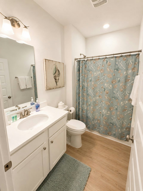 Another well-appointed full bath with fresh finishes and coastal charm—plenty of room for a busy household to share.