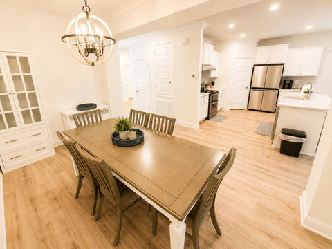 Gather around the dining table for six beneath a statement chandelier—the ideal spot for shared meals and lively game nights.