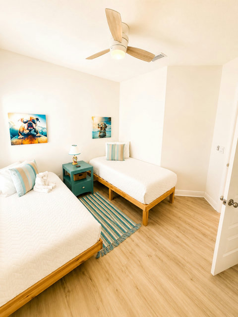 Thoughtfully styled with coastal charm, this twin room offers comfy beds and a bright, playful space for younger guests.