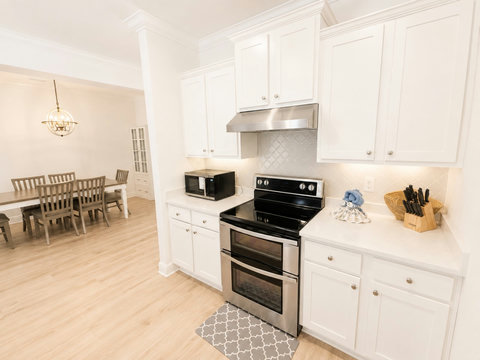 A fully equipped kitchen with a full-size range, microwave, and generous counter space—cooking for the whole group is a breeze.