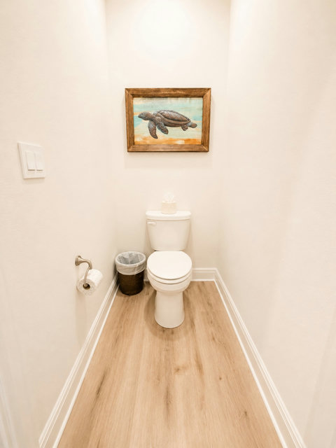 A convenient guest bath with cheerful coastal touches—thoughtful details throughout make everyone feel right at home.