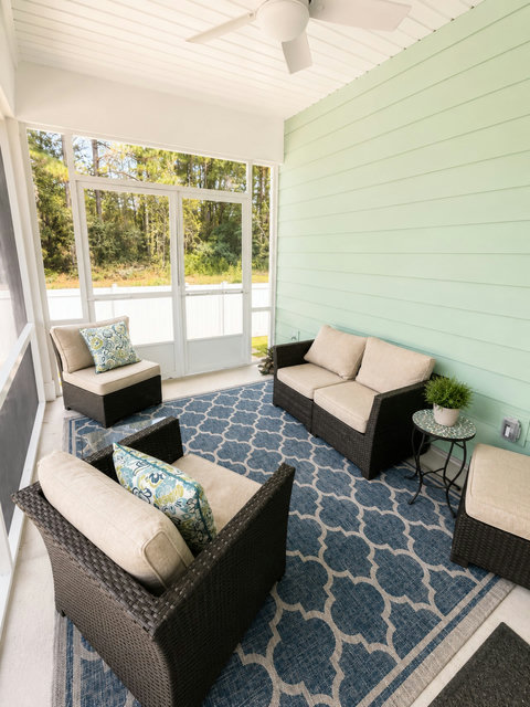 Sip your morning coffee on the screened-in porch, where comfy seating and breezy shade make for the perfect hangout spot.