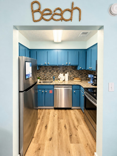 Ocean-blue kitchen ready for vacation meals