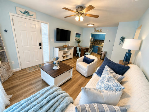 Bright open-concept living with coastal decor