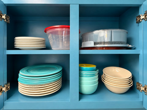 Well-stocked cabinets with plates and bowls