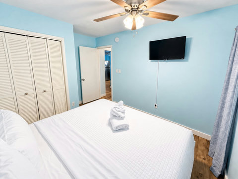 Guest bedroom with linens and closet space