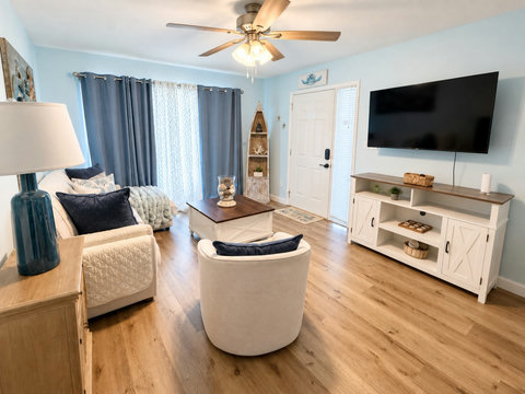 Coastal living room with smart TV and seating