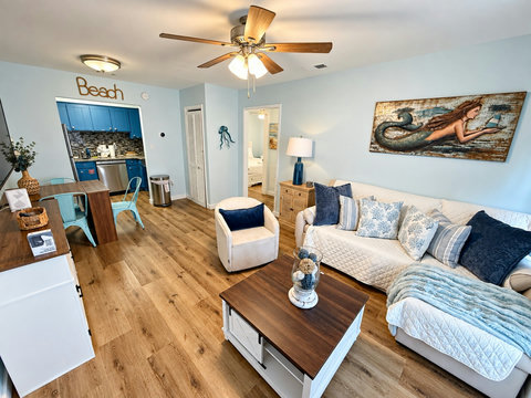 Living space flowing to dining and kitchen