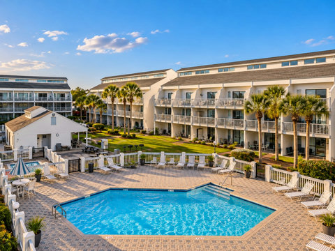 Sparkling community pool with lounge chairs