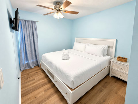 Bright coastal bedroom with crisp white linens