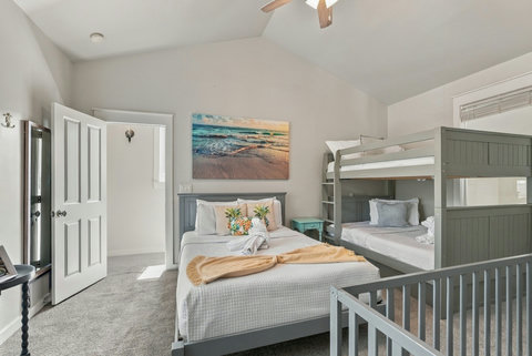 Bunk room with vaulted ceiling and full-over-full bunks