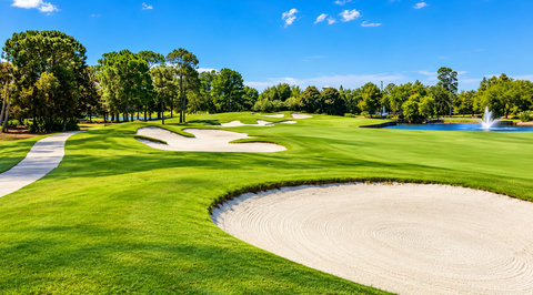 Sunlit Fairway with Bunkers and Fountain