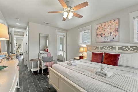 Primary bedroom with king bed and ceiling fan