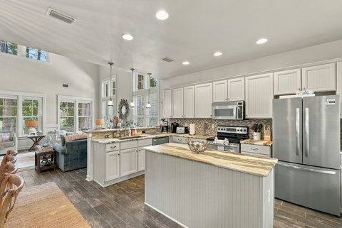 Kitchen with island, range and refrigerator