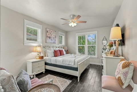 Primary bedroom with king bed and TV