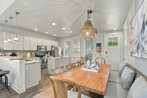 Dining table with kitchen in view