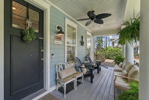 Welcoming front porch with seating and hanging chair