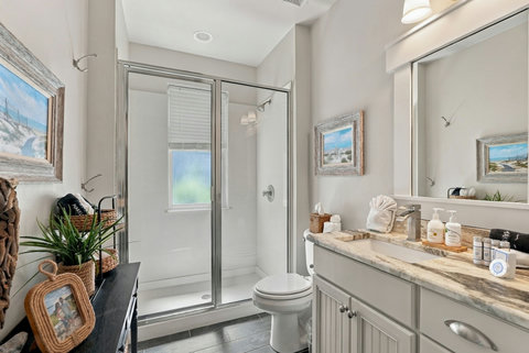 En-suite bathroom with glass shower and vanity