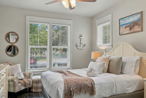 Guest bedroom with queen bed and coastal decor