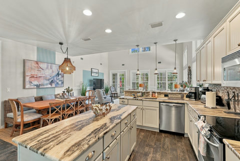 Kitchen island with dishwasher and living room view