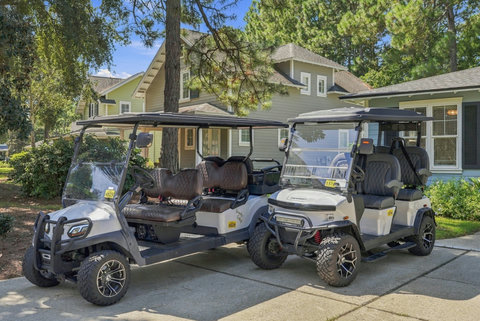 Golf carts ready for rides to the beach path