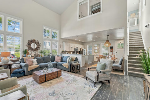 Open living room flowing into kitchen and dining